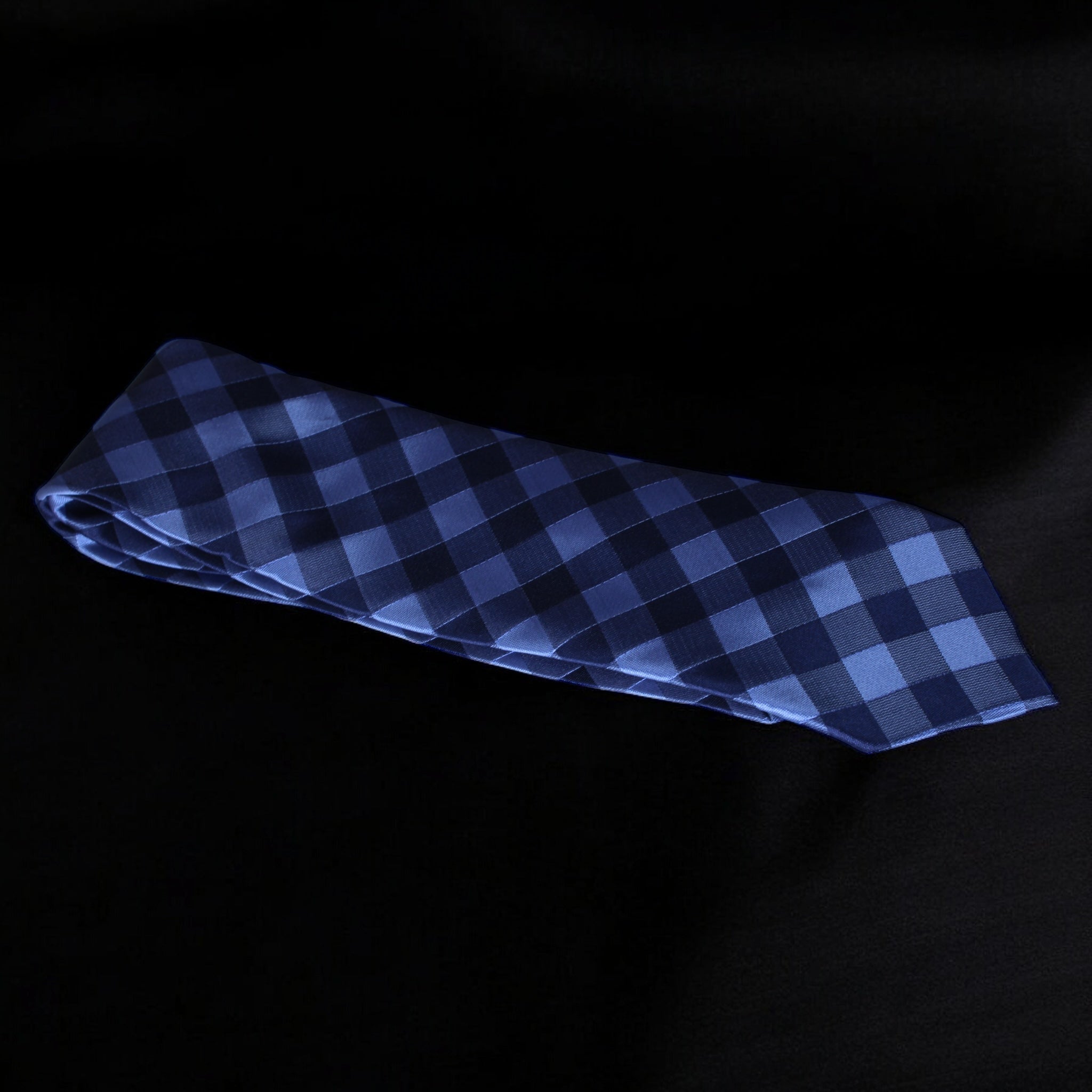 Blue checkered tie on a black background