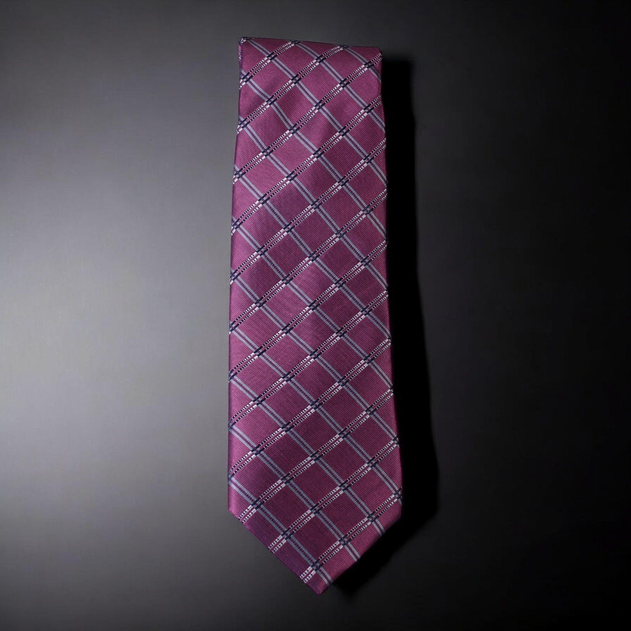 Pink checkered tie on a dark gray background
