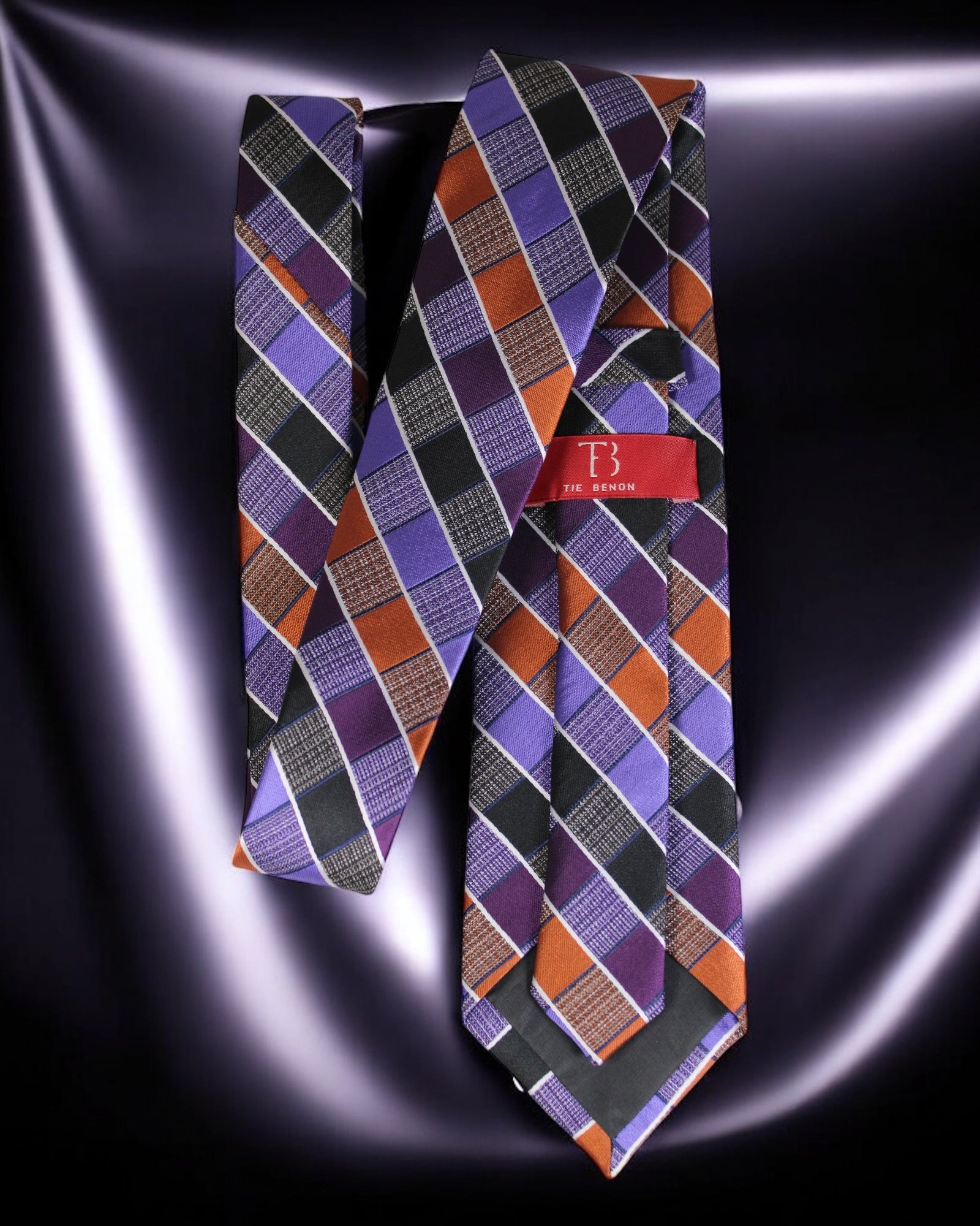 Plaid patterned tie with a brand label on a dark background Tie Benon