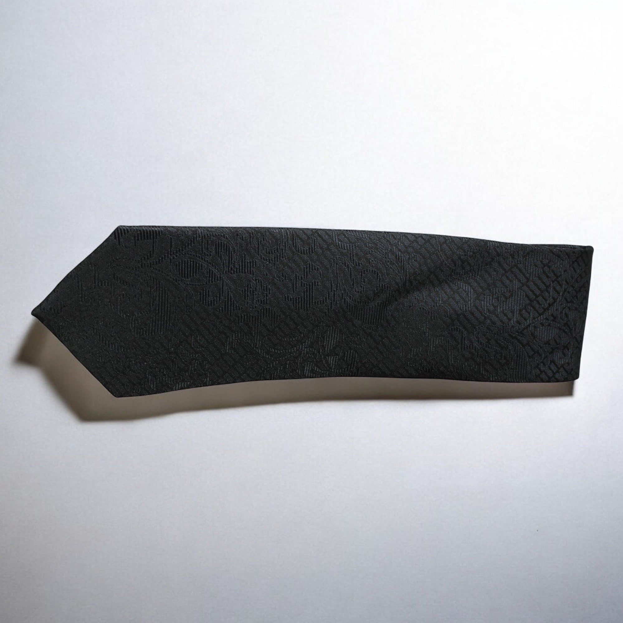 Black textured bandeau top on a light gray background