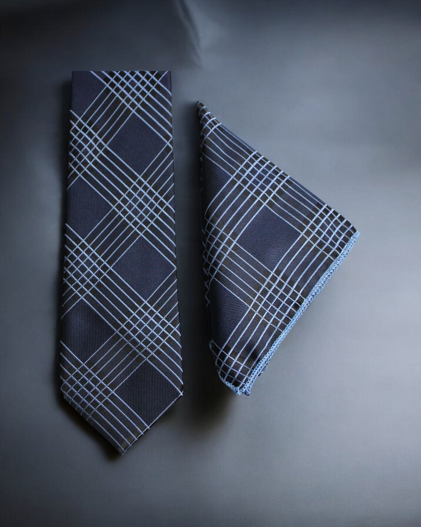 Navy blue tie and pocket square with white geometric pattern on a gray background Tie Benon