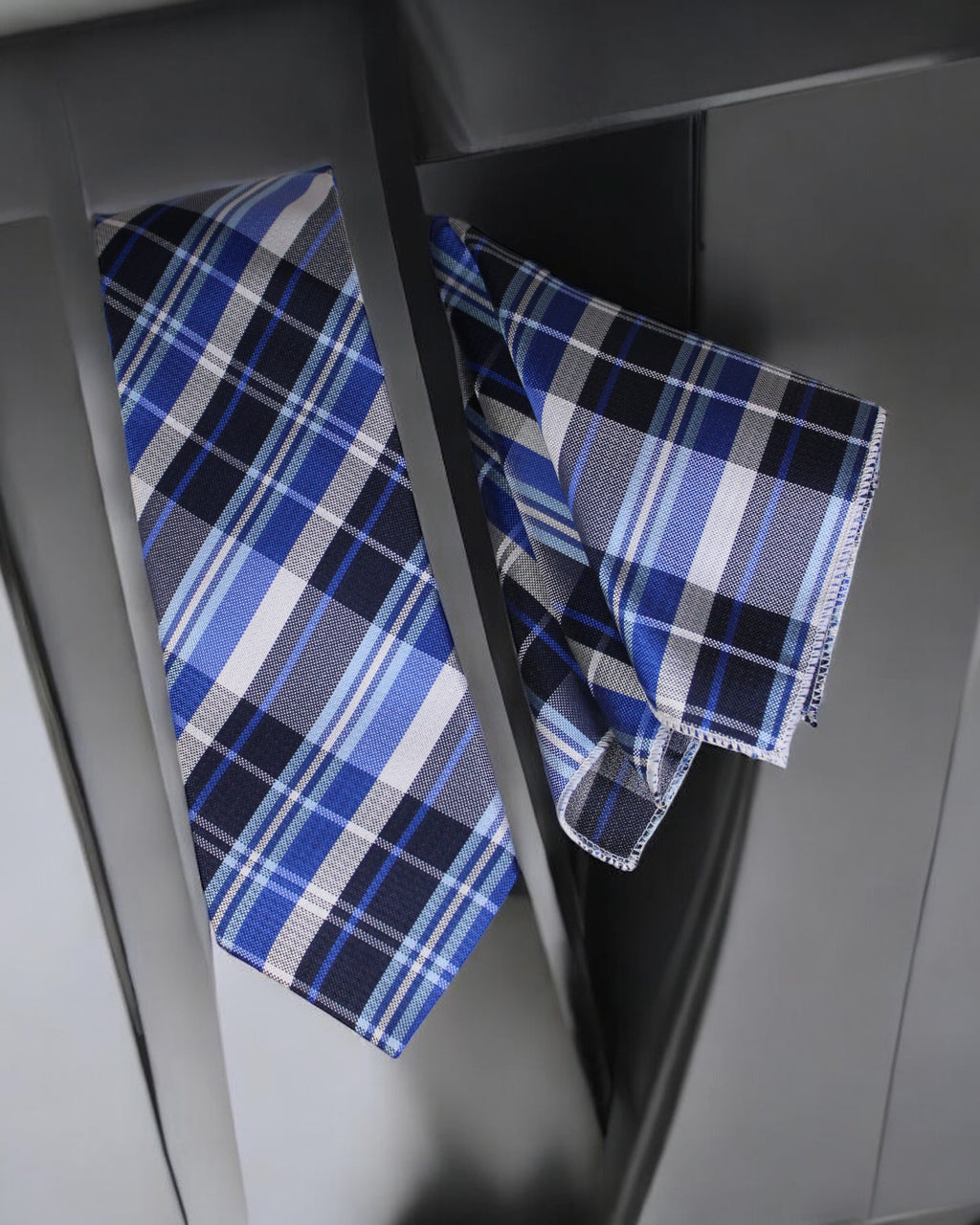Blue and white plaid fabric on a metallic surface