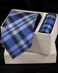 Blue plaid tie and pocket square set in a white box on a black background Tie Benon