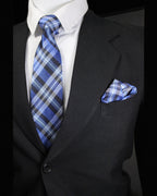 Black suit with blue plaid tie and pocket square on a black background Tie Benon