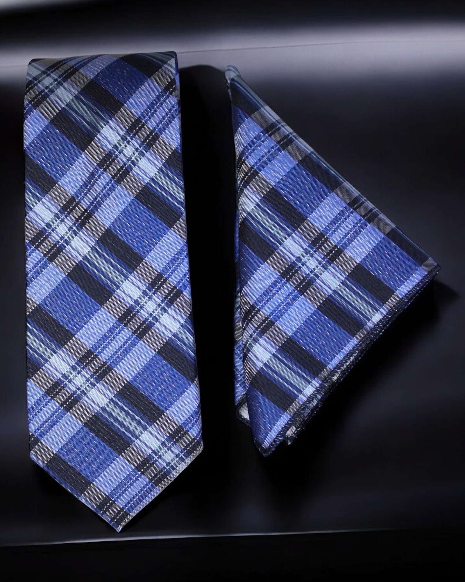 Blue plaid tie and matching pocket square on a dark background Tie Benon