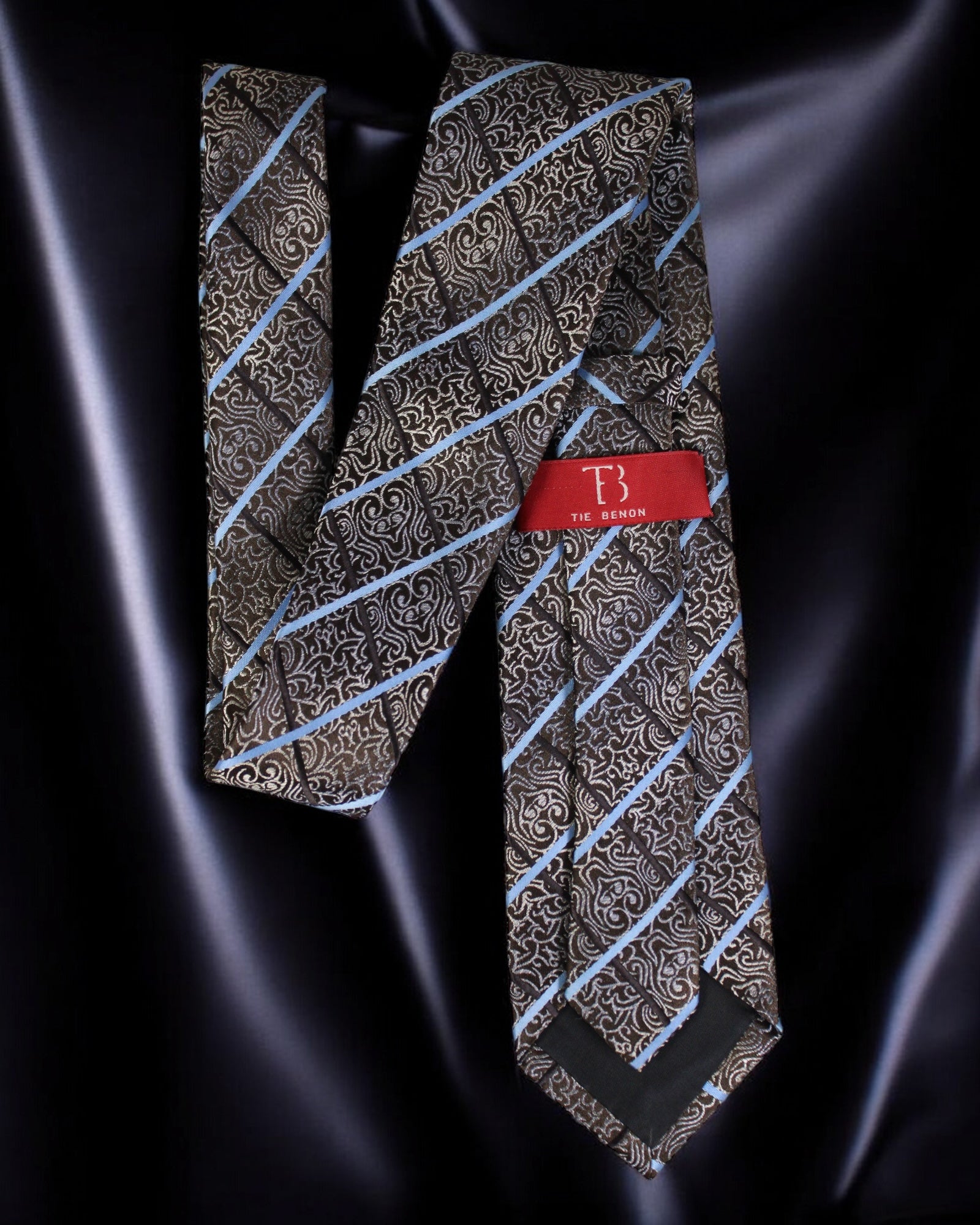Patterned tie with a red label on a dark satin background Tie Benon