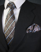 Black suit with patterned tie and pocket square on a white background Tie Benon