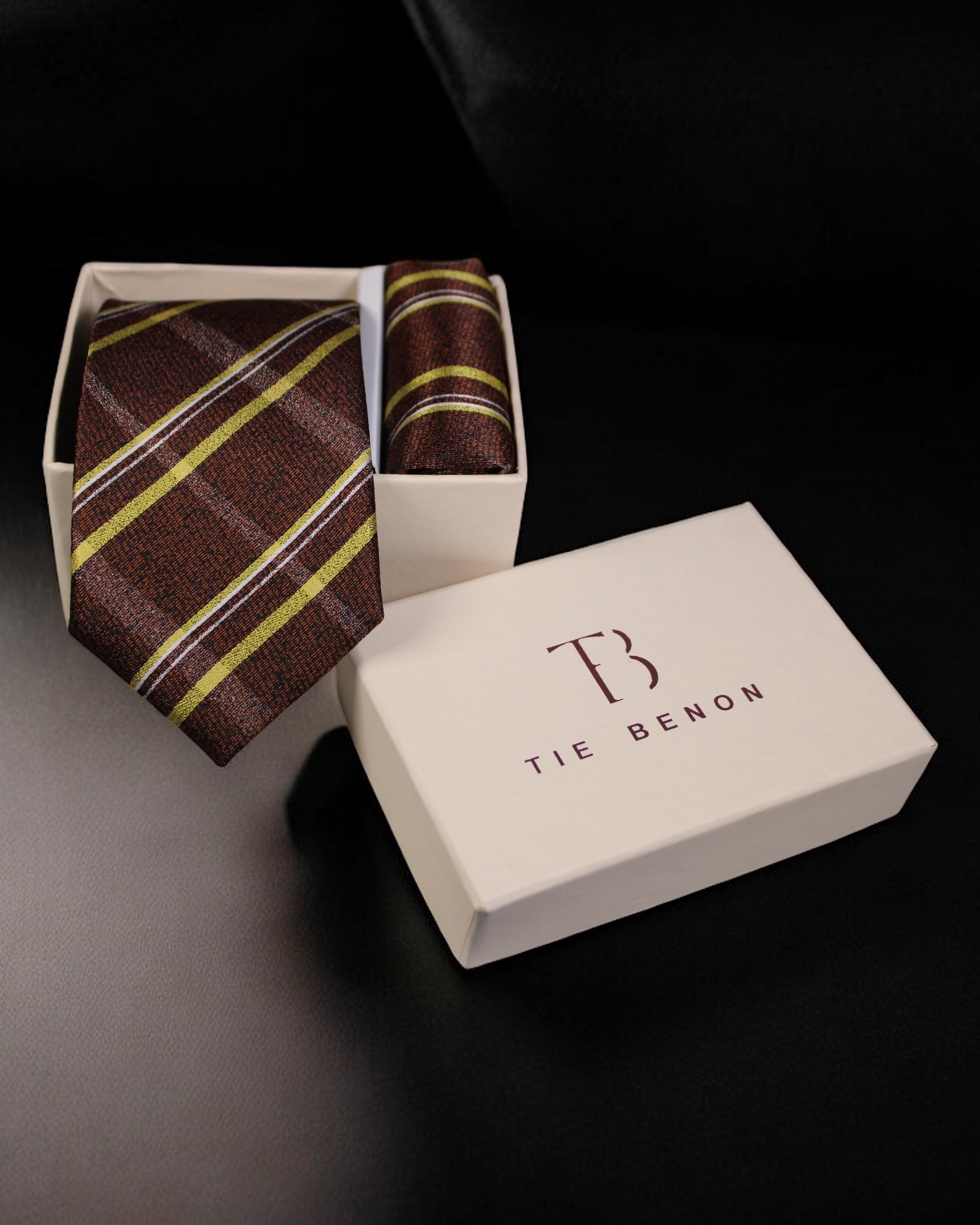 Striped tie and pocket square in a Tie Benon box on a dark background Tie Benon