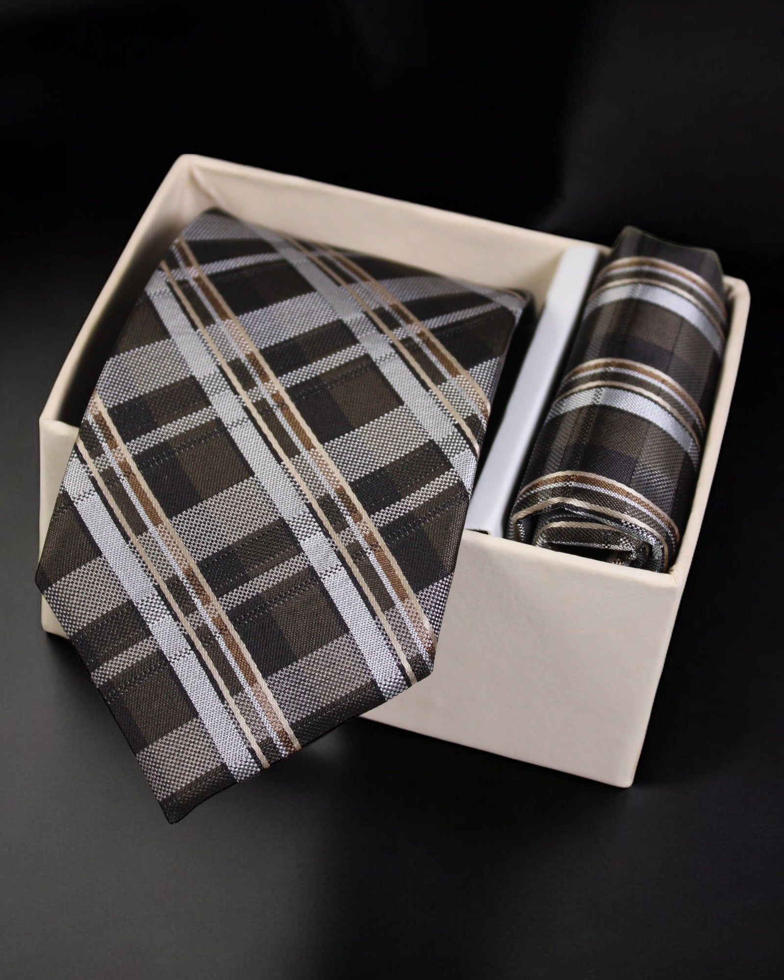 Plaid tie and handkerchief set in a box on a black background tie Benon