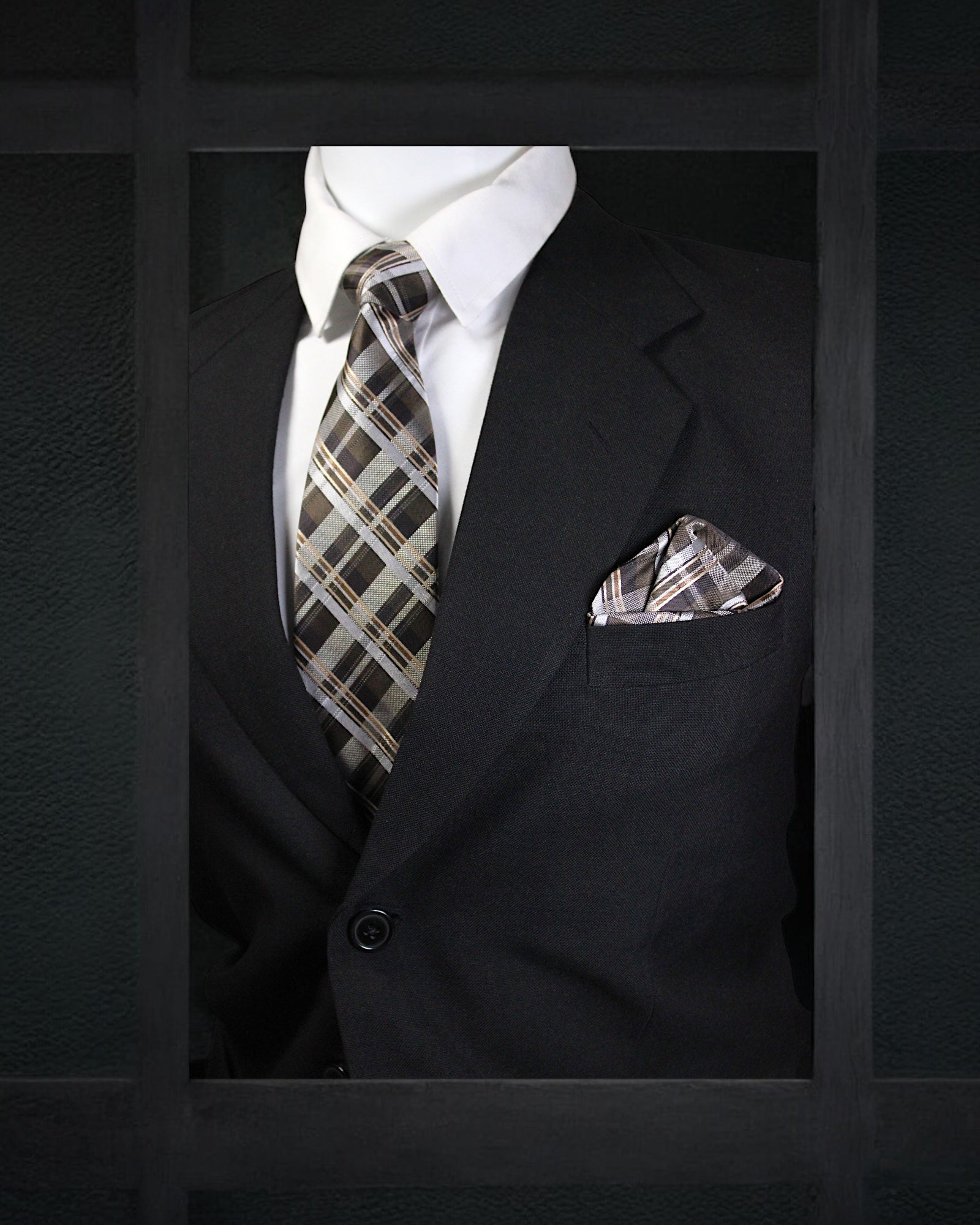 Black suit with plaid tie and pocket square on a dark background tie Benon