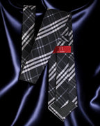 Plaid tie with a red label on a dark fabric background Tie Benon