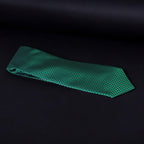 Green checkered tie on a black background