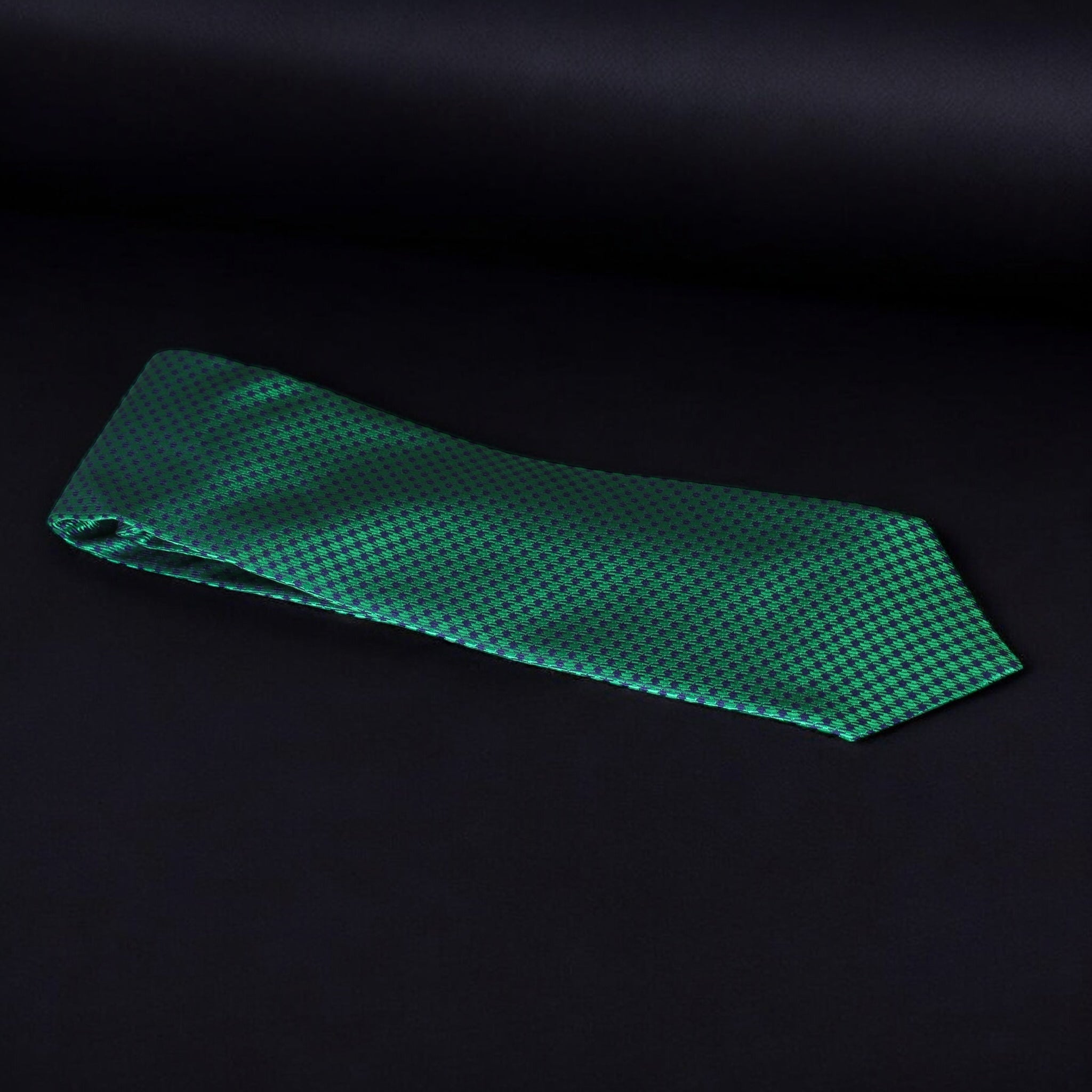 Green checkered tie on a black background