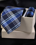 Blue plaid tie and pocket square set on a white box with a black background