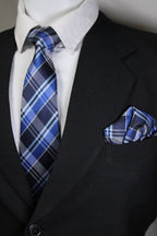 Blue plaid tie and pocket square on a suit jacket