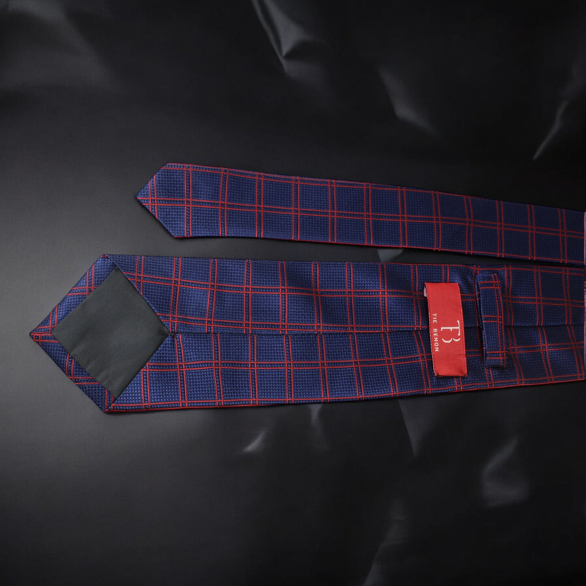 Blue and red checkered tie on a black background