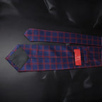 Blue and red checkered tie on a black background