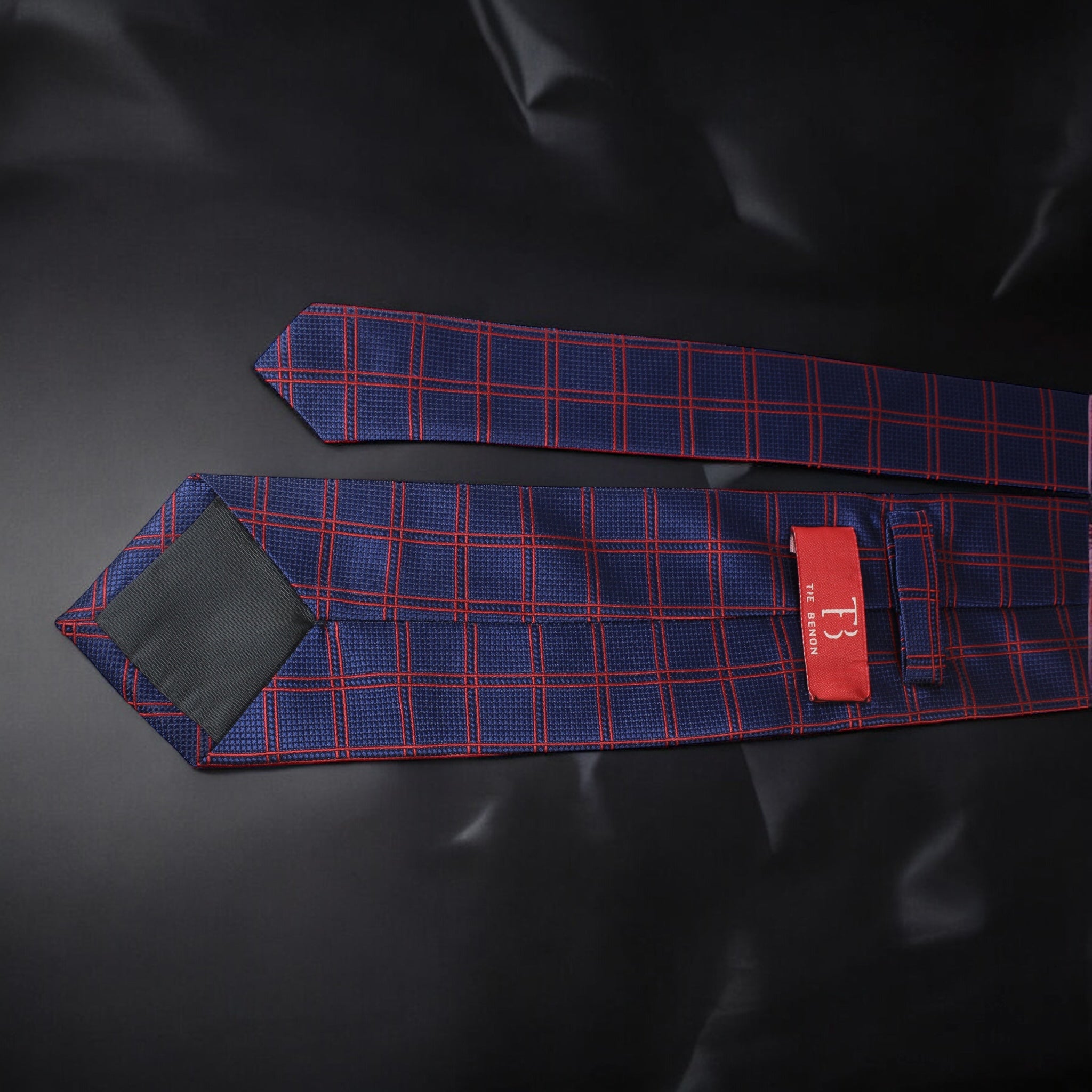 Blue and red checkered tie on a black background