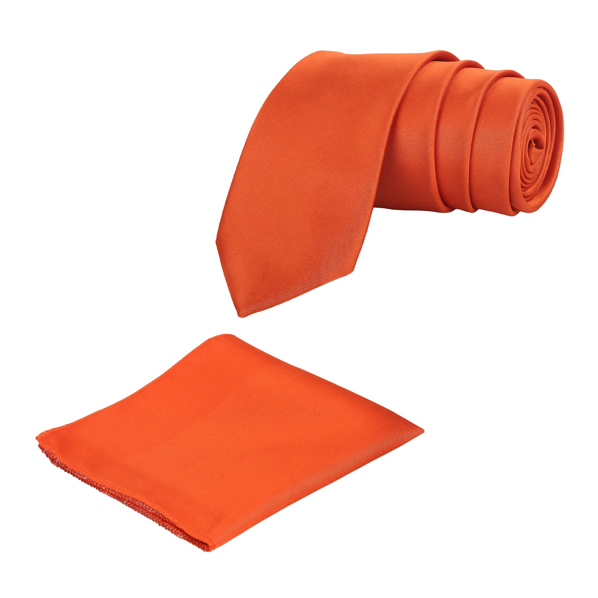 A rolled-up dark orange necktie with a matching pocket square, both laid out on a white background.