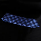 Blue checkered tie on a black background