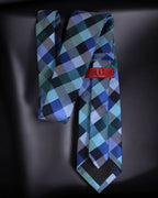 Plaid tie with a red label on a dark background Tie Benon