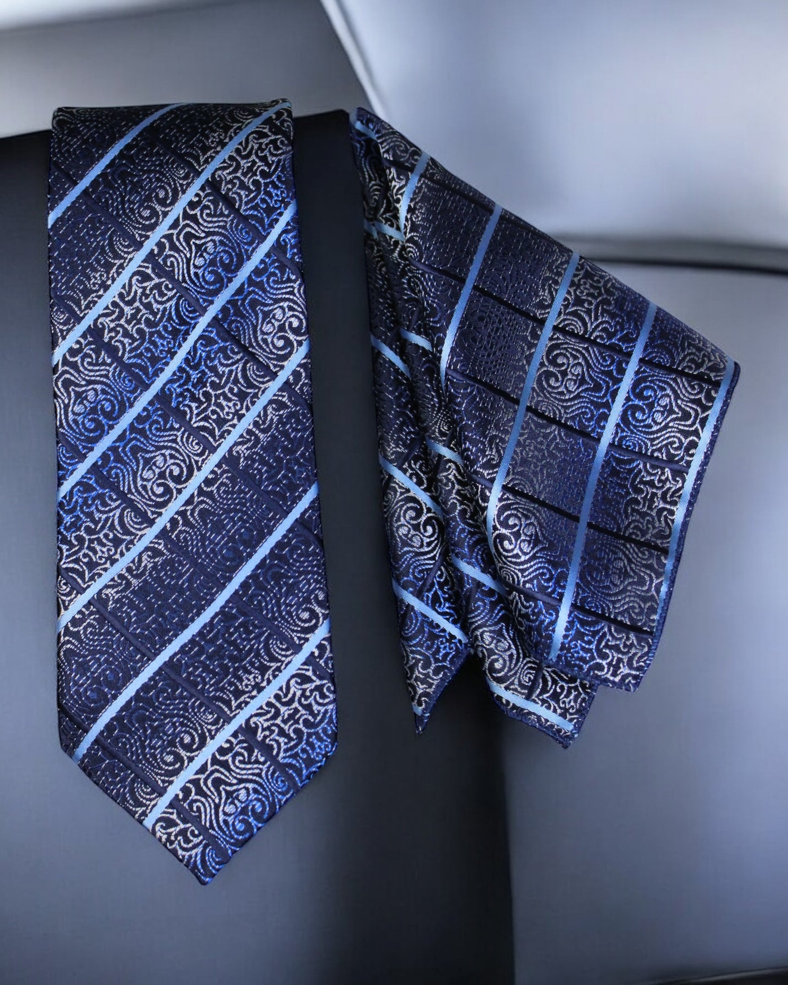 Two patterned ties on a dark background tie Benon