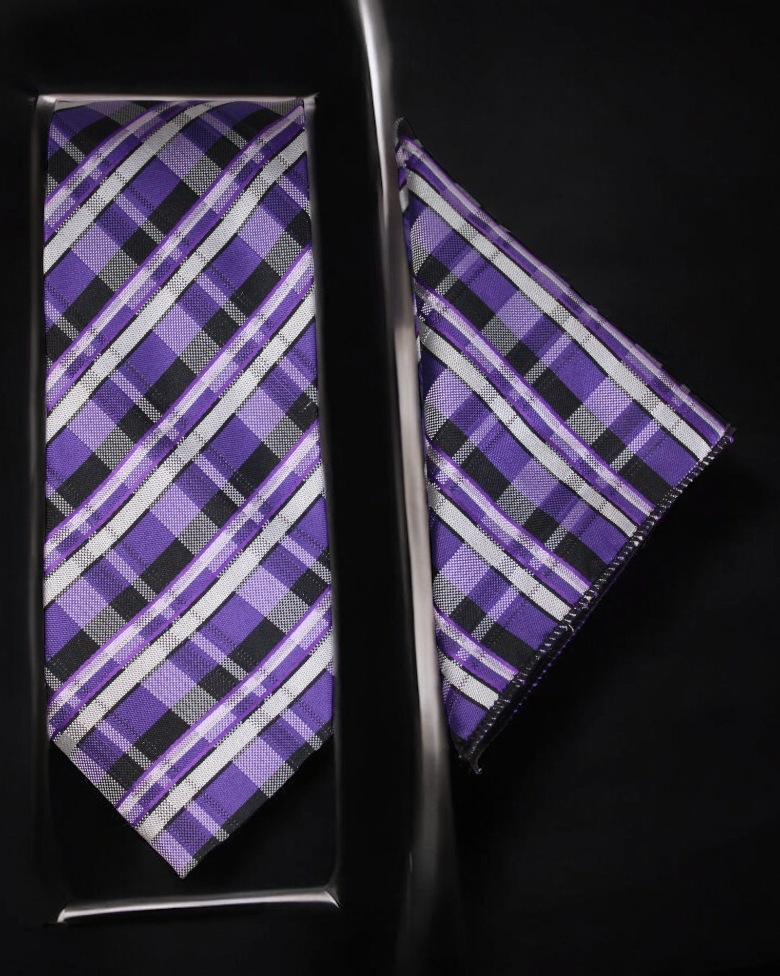 Purple and black plaid tie and pocket square set on a dark background Tie Benon