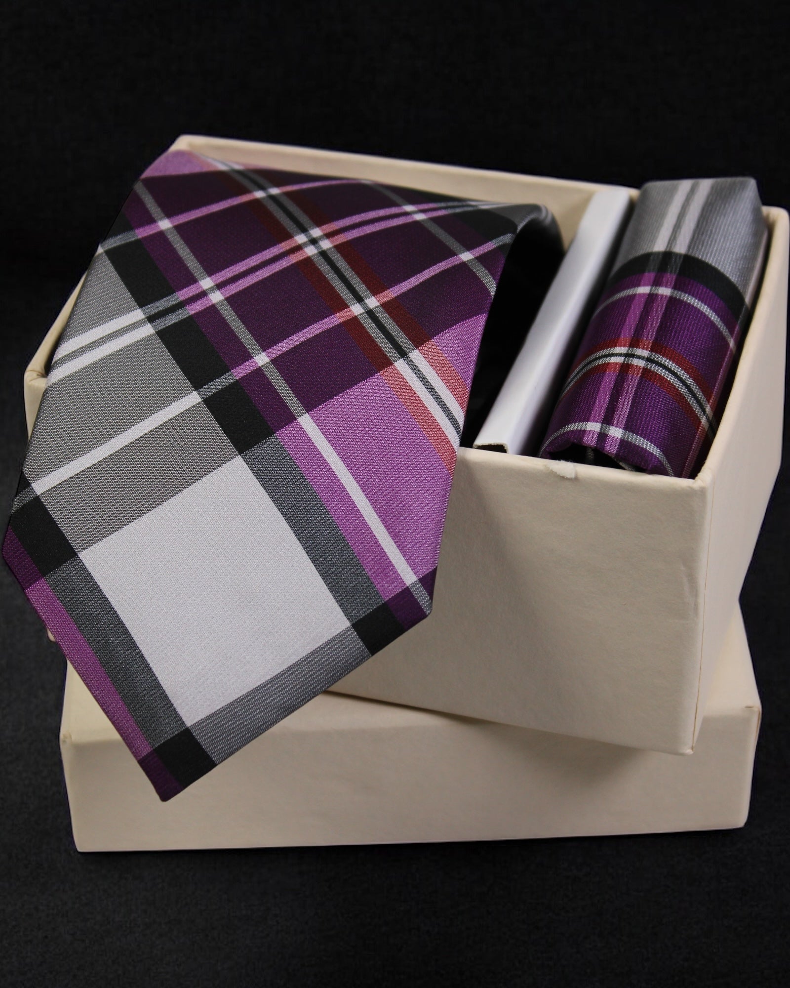 Plaid tie and pocket square set in a box on a black background Tie Benon