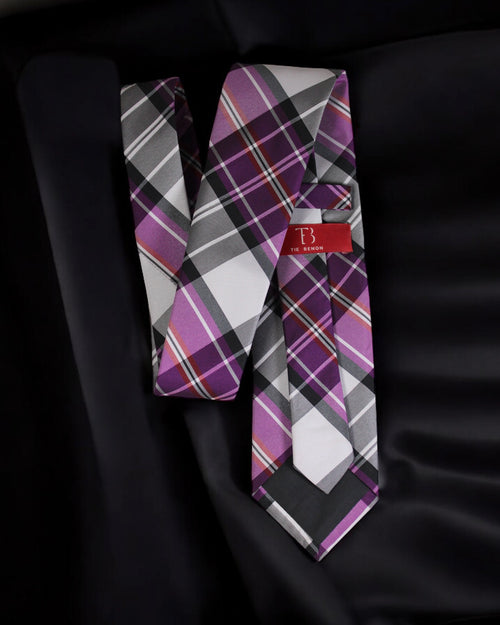 Plaid tie with a brand label on a black background Tie Benon