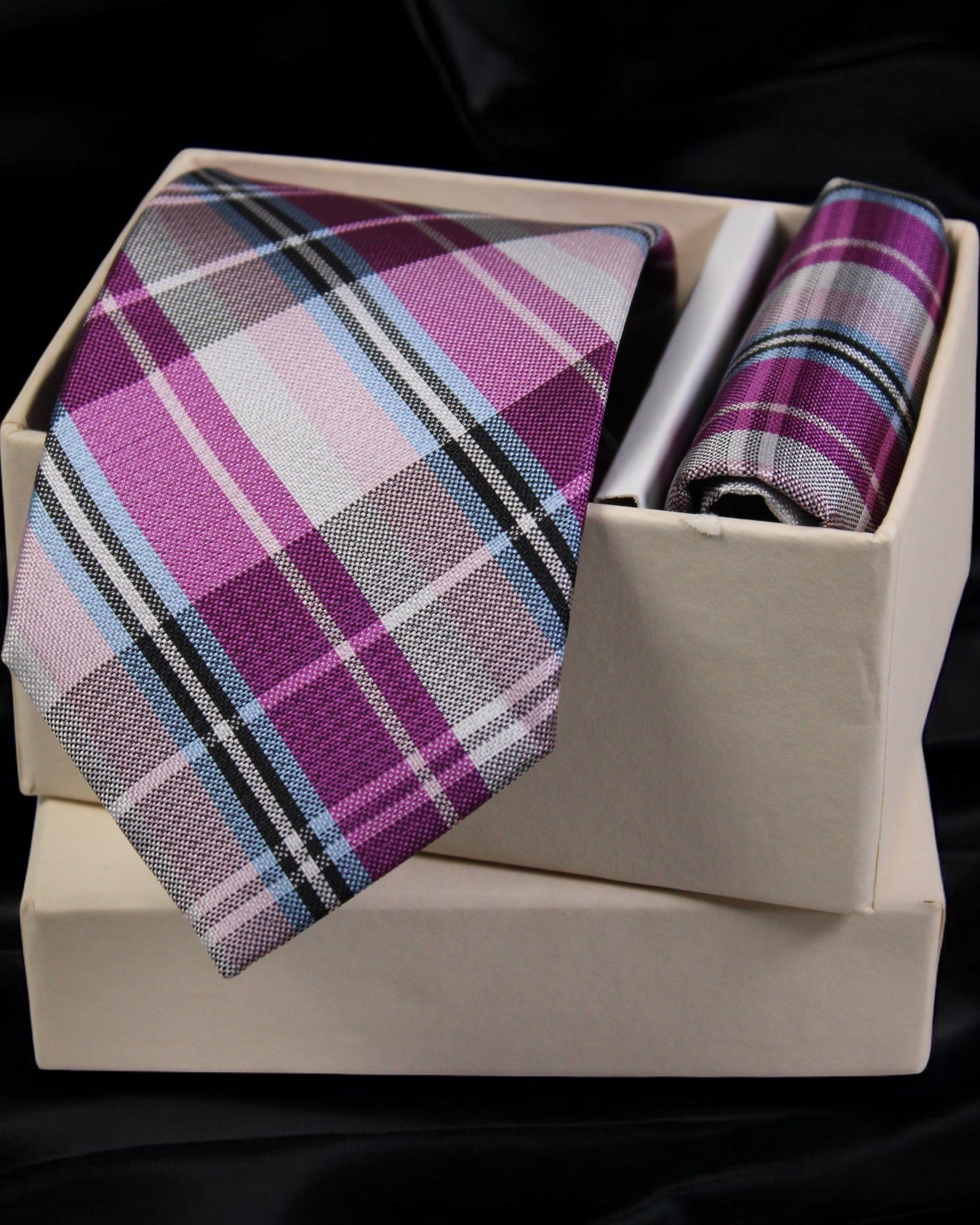 Plaid tie and pocket square set in a box on a black background Tie Benon