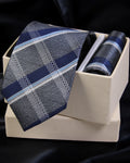 Blue plaid tie and matching pocket square in a white box on a black background Tie Benon