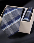 Blue patterned tie and pocket square set in a box on a dark background Tie Benon