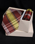 Plaid tie and pocket square set in a white box on a black background Tie Benon