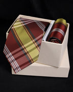 Plaid tie and pocket square set in a white box on a black background Tie Benon
