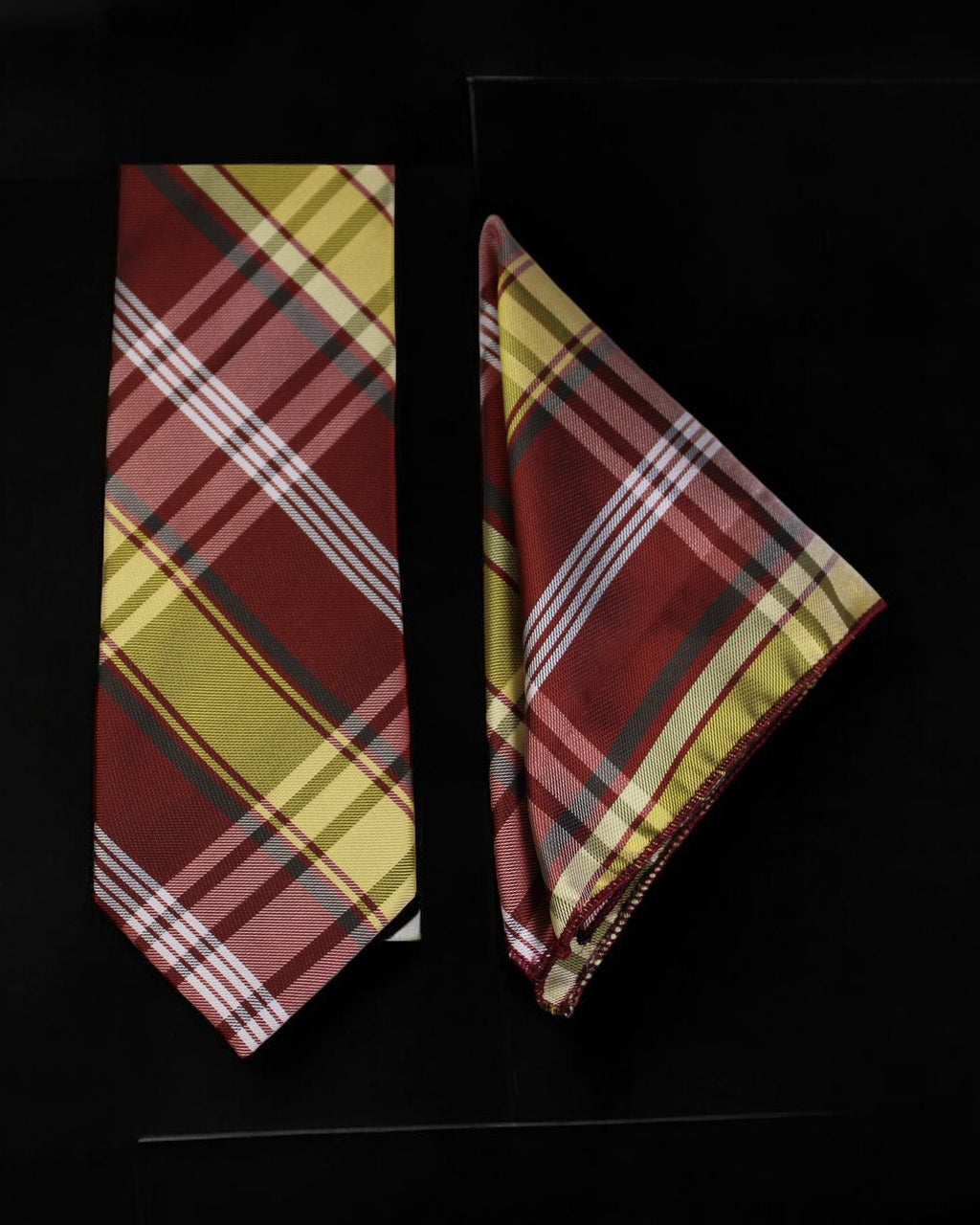Plaid tie and pocket square set on a black background Tie Benon