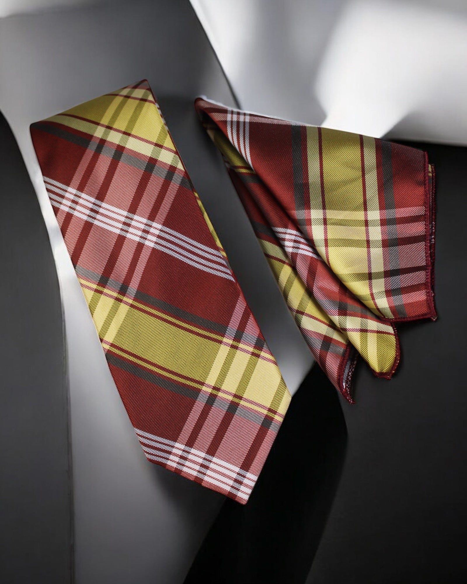 Plaid tie and pocket square set on a dark surface tie Benon