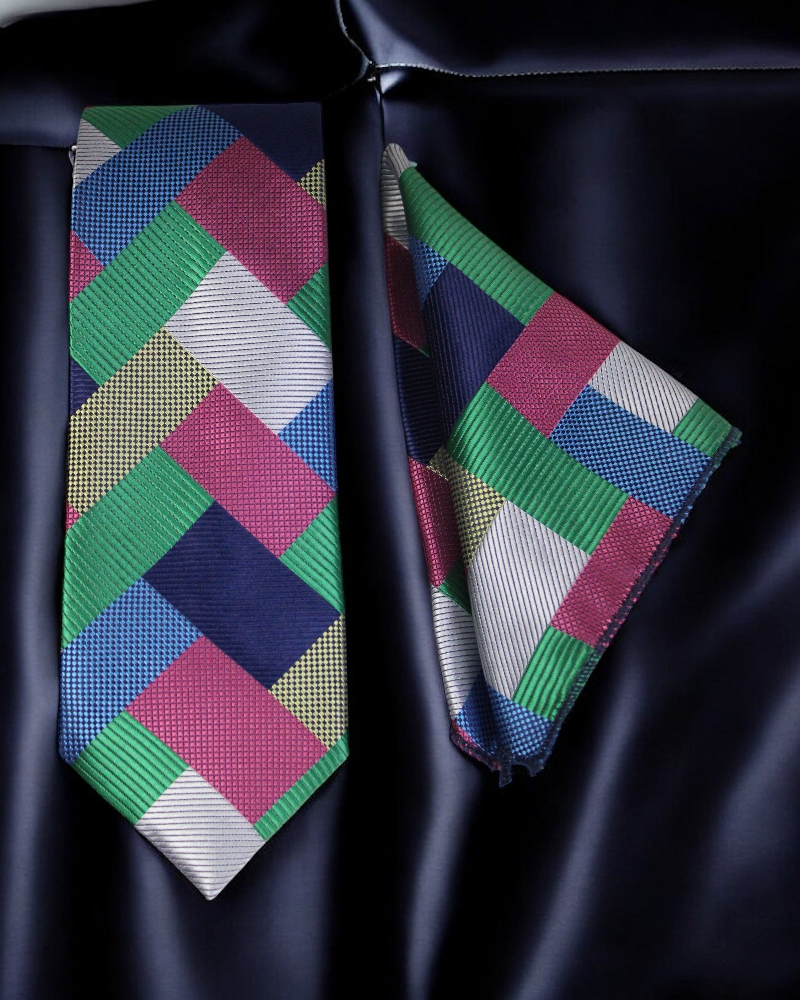 Colorful geometric-patterned tie and pocket square on a dark background Tie Benon