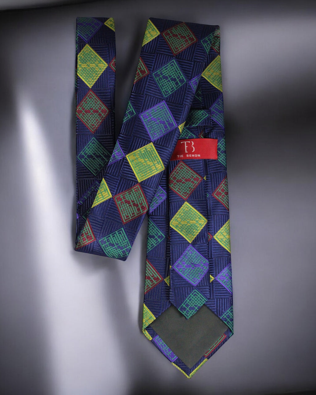 Colorful patterned tie with a brand label on a gray background Tie Benon