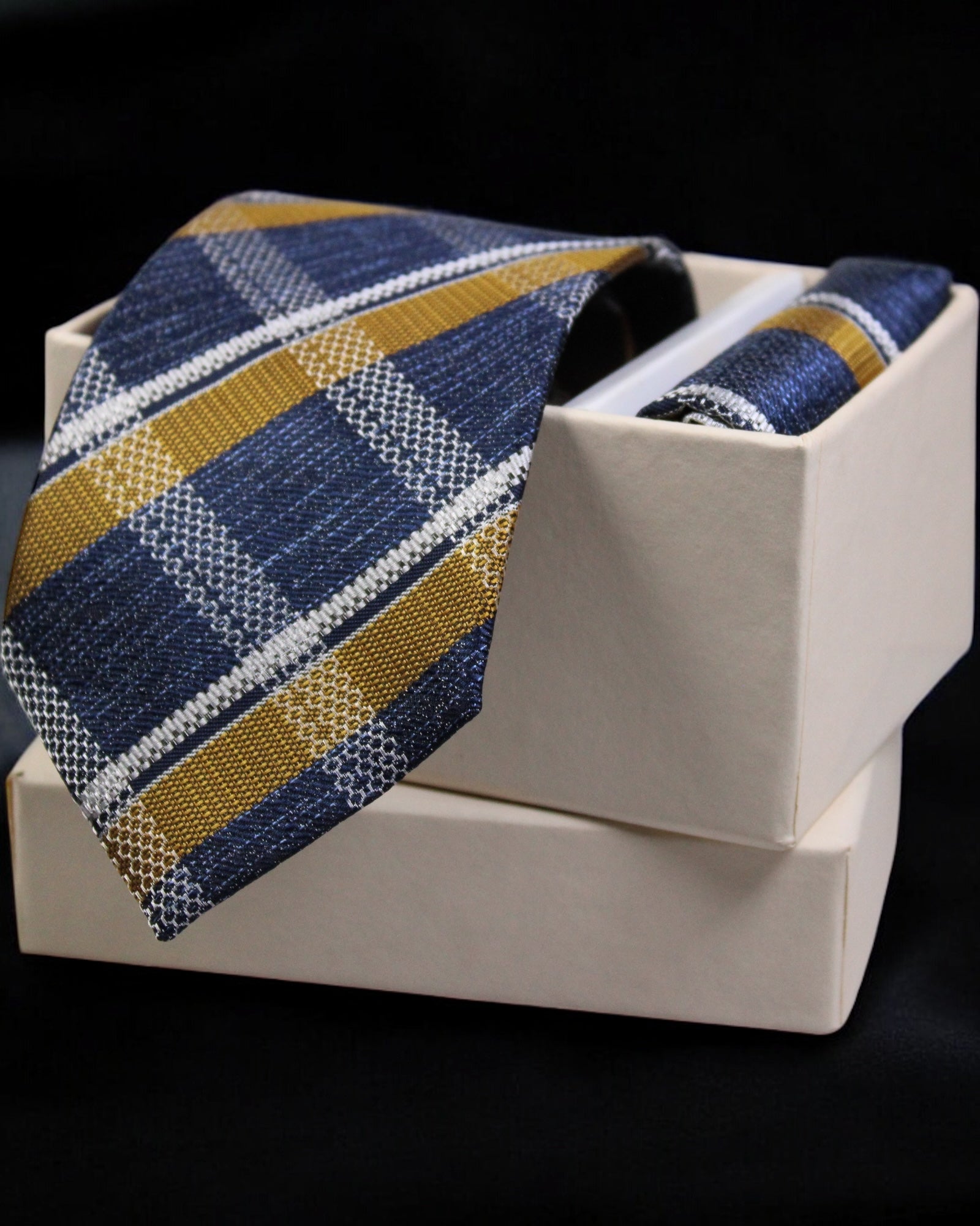 Striped tie with a pocket square in a white box on a black background Tie Benon