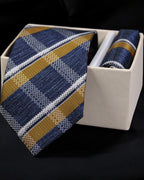 Blue and gold striped tie with matching pocket square in a white box on a black background