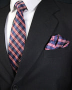 Black suit with a red, white, and blue plaid tie and pocket square Tie Benon