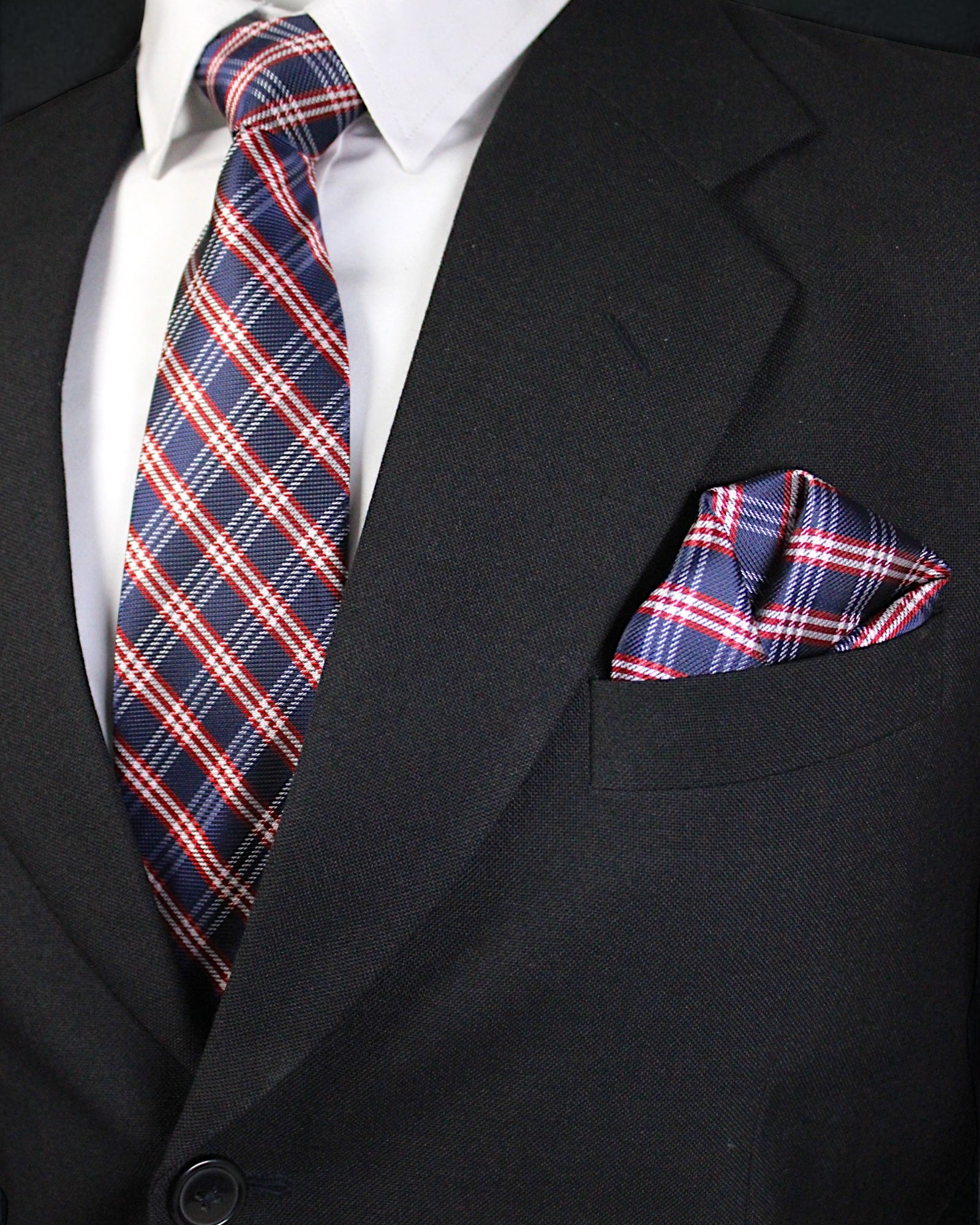 Black suit with a red, white, and blue plaid tie and pocket square Tie Benon