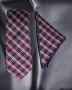 Navy blue plaid tie and matching pocket square on a dark background Tie Benon