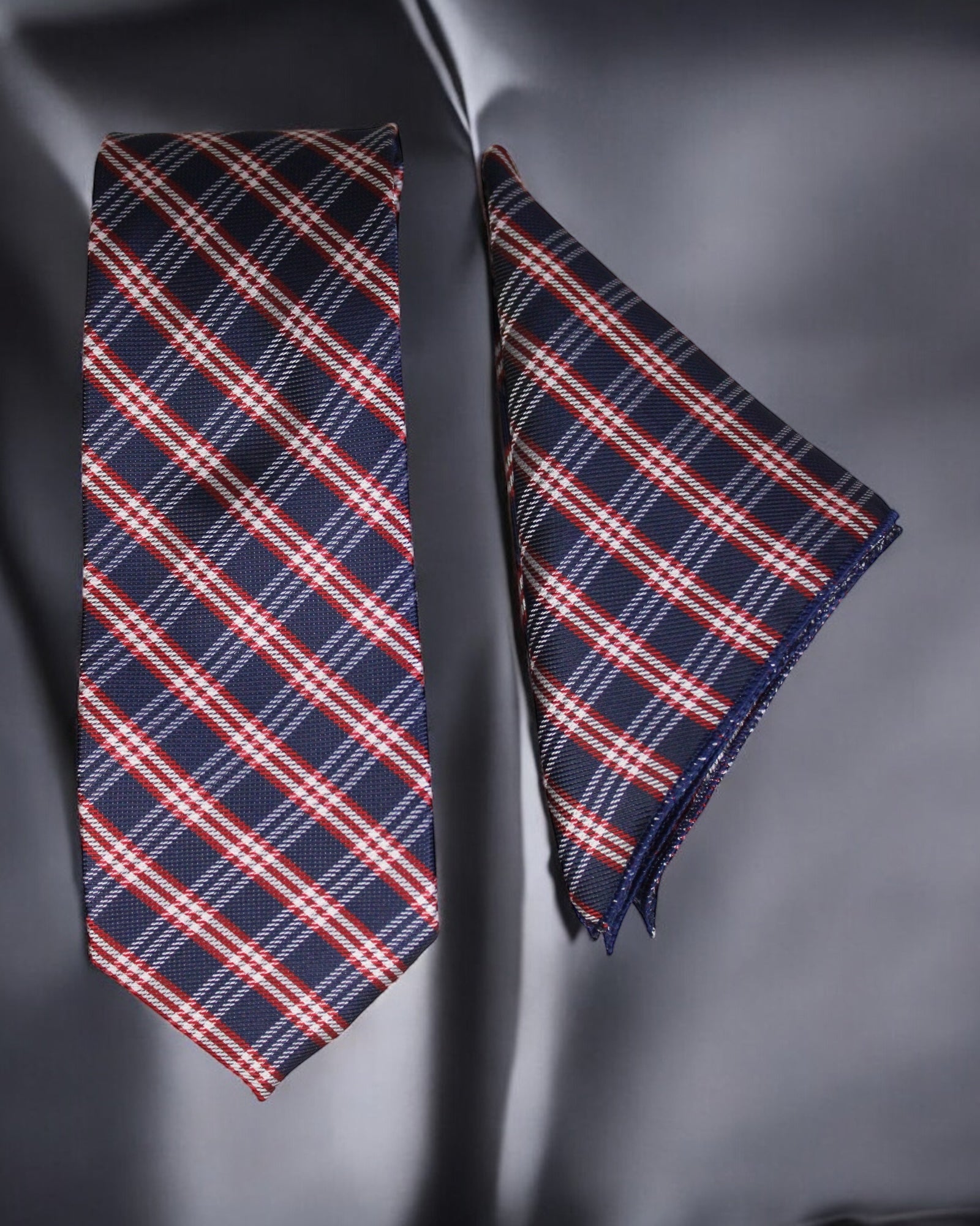 Navy blue plaid tie and matching pocket square on a dark background Tie Benon