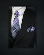 Black suit with a white shirt, purple and gray striped tie, and matching pocket square on a dark background. tie Benon