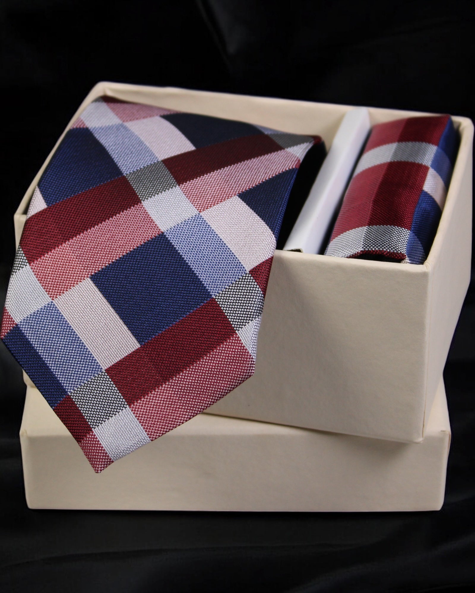 Plaid tie and pocket square set in a box on a black background Tie Benon