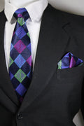 Close-up of a suit with a patterned tie and pocket square Tie benon
