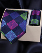 Navy tie with colorful geometric pattern in a white box on a dark background Tie Benon