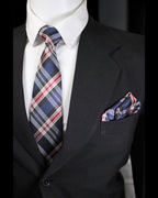 Black suit with plaid tie and pocket square on a mannequin against a black background Tie Benon