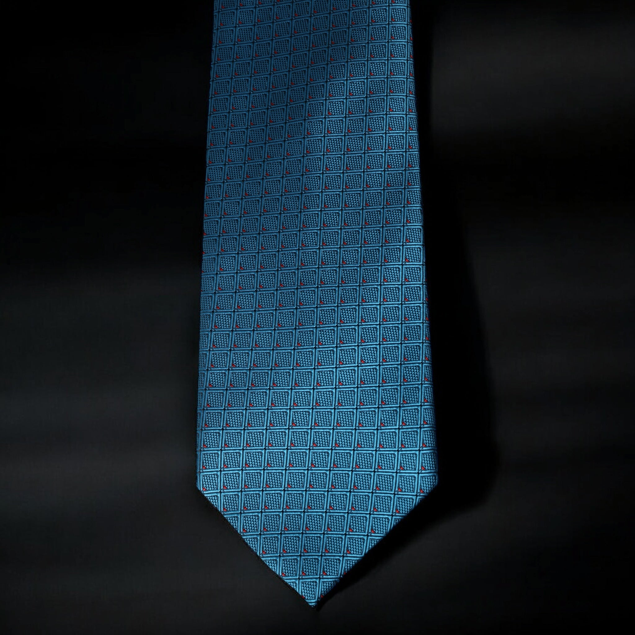 Blue patterned tie on a black background